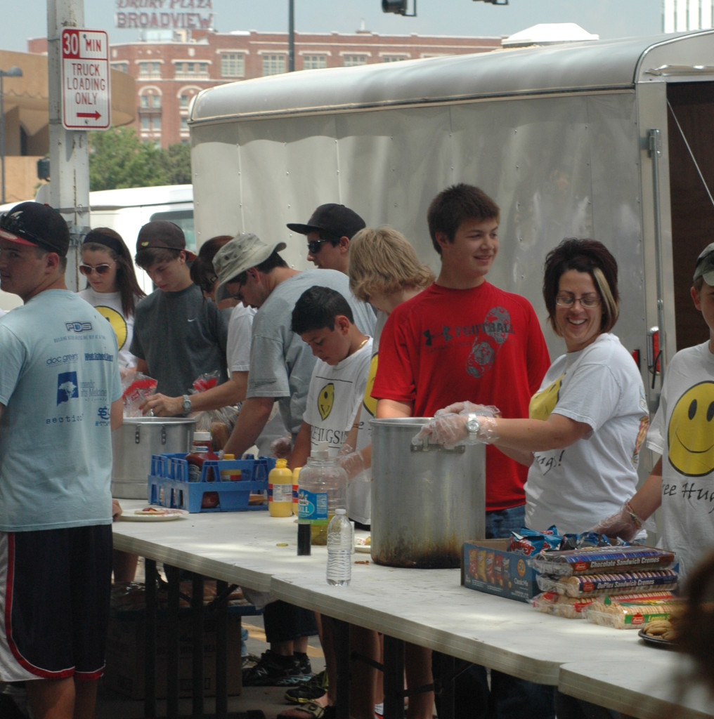A group of young Spark Givers feeding the homeless.