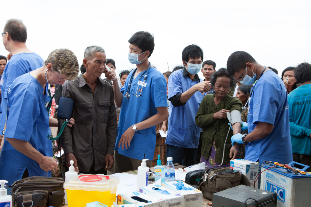 International medical staff working alongside local doctors in mobile rural clinic. photo credit: Paul Pichugin Photography.