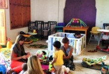 Inside the orphanage volunteers play with the children