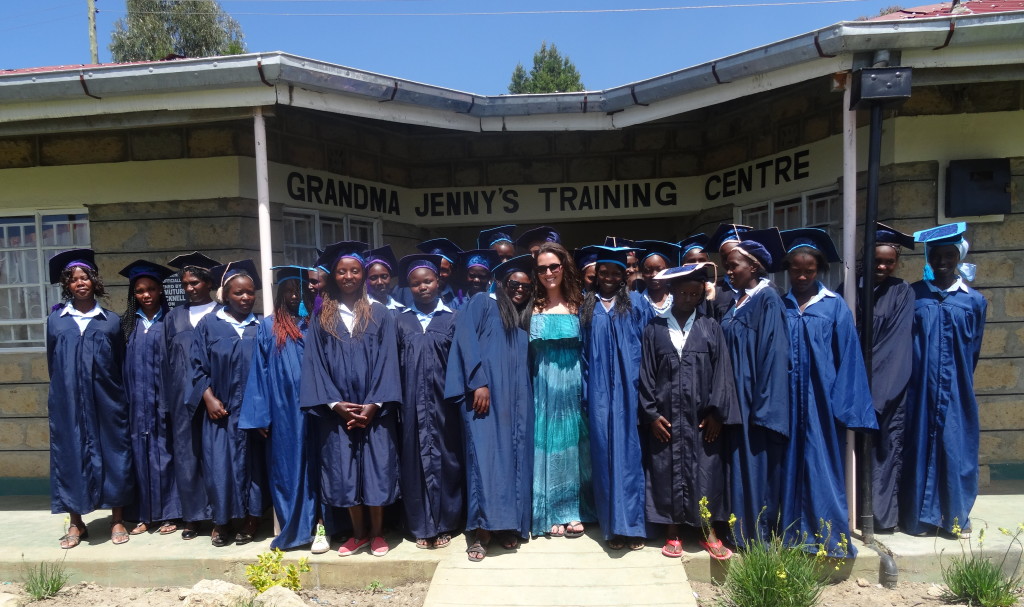 Genna standing proudly with the first graduates of Grandma Jenny's Training Centre, in 2013.