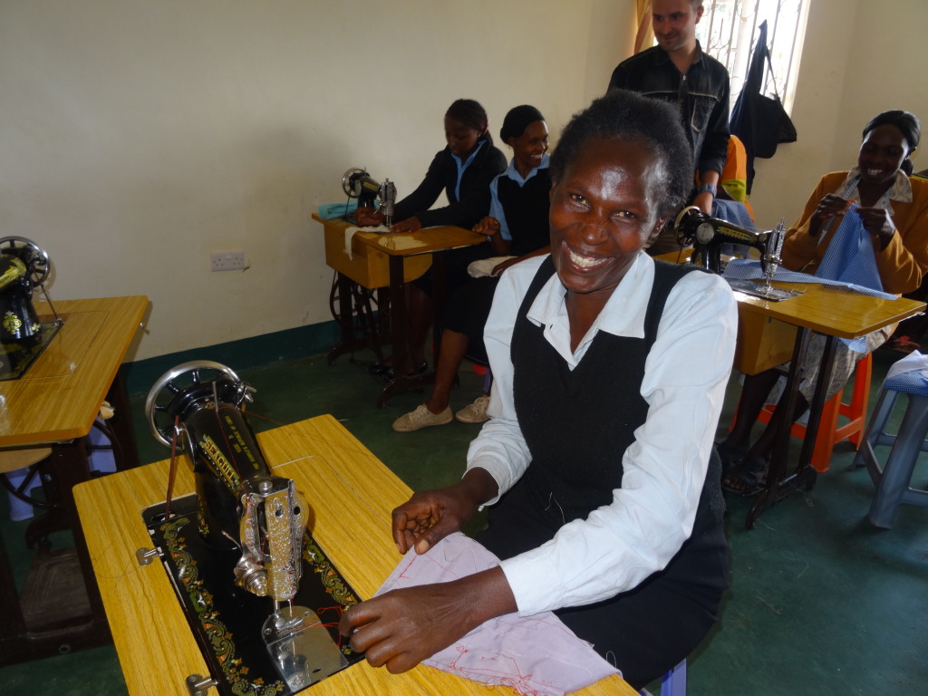  A Grandma Jenny's Training Centre graduate, making school uniforms.