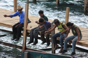 Boys fish of the dock in Santa Cruz de Atitlan