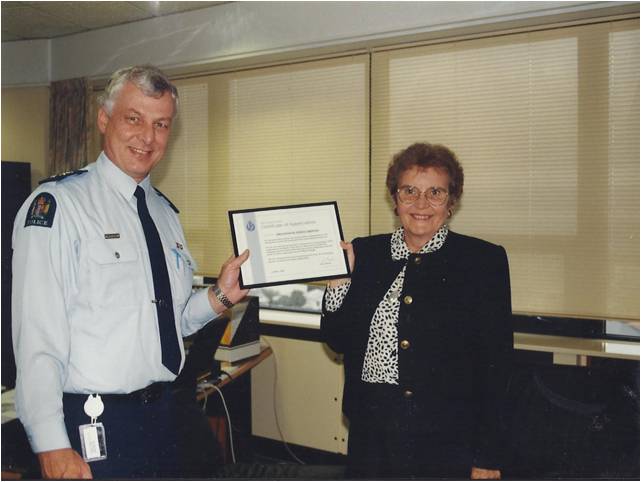 Dr. Freda Briggs - receiving citation from Commissioner of Police, NZ