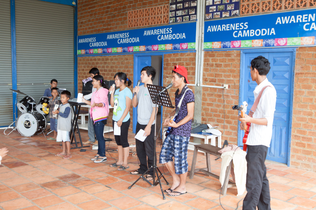 Sunshine House children putting on a concert for the community. Photo credit: Paul Pichugin Photography.