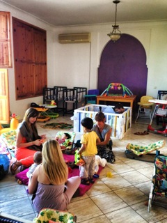 Inside the orphanage volunteers play with the children