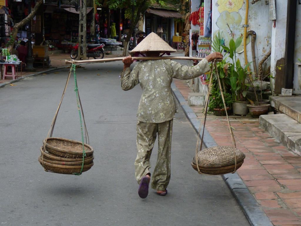 Hoi An, Vietnam - if you're old you still keep working...